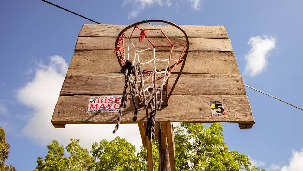 old wooden basketball hoop with rust